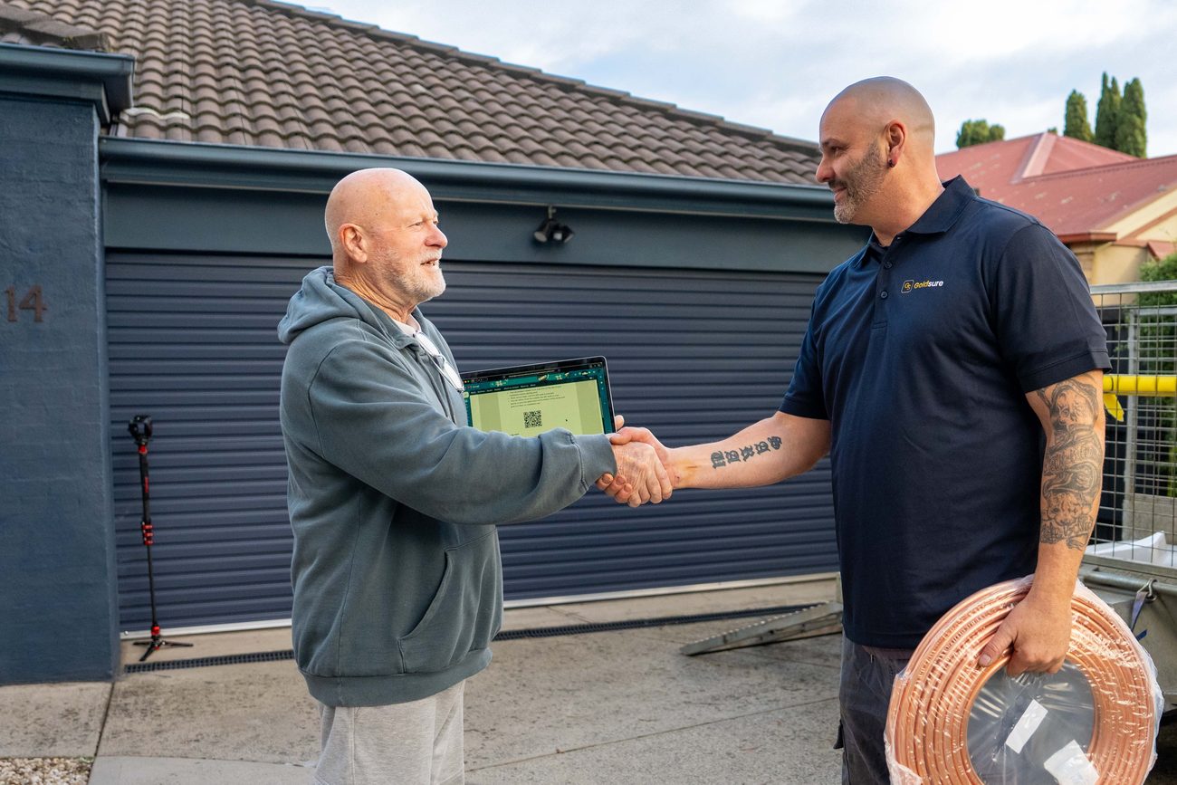 Goldsure installer shaking hands with a Melbourne homeowner after an honest, no-surprises quote